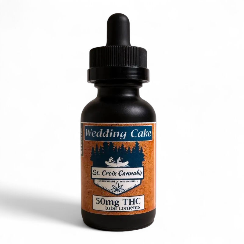 Bottle of 'Wedding Cake' from St. Croix Cannabis with a dropper on a white background